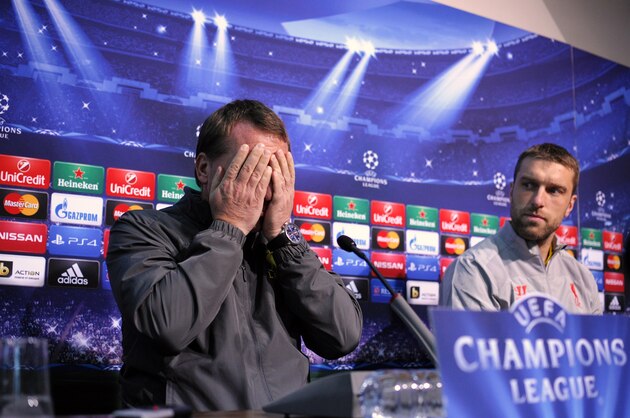 Liverpool's head coach Brendan Rodgers (L) reacts as Liverpool's forward Rickie Lambert looks on during a press conference on November 25, 2014 in Sofia, on the eve of the Champions League group B football match between FC Ludogorets and FC Liverpool.  AFP PHOTO / NIKOLAY DOYCHINOV        (Photo credit should read NIKOLAY DOYCHINOV/AFP/Getty Images)