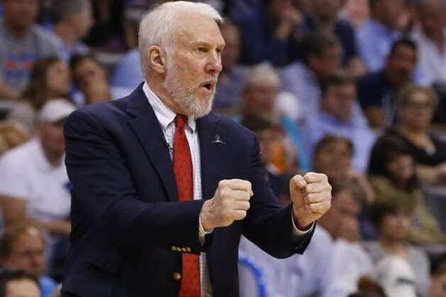 FILE - In this April 7, 2015, file photo, San Antonio Spurs coach Gregg Popovich gestures during the third quarter of an NBA basketball game against the Oklahoma City Thunder in Oklahoma City. Popovich will guide Team Africa against Team World in the NBA's first game in Africa, Aug. 1, in Johannesburg, the league announced Thursday, July 16, 2015.  (AP Photo/Sue Ogrocki, File)