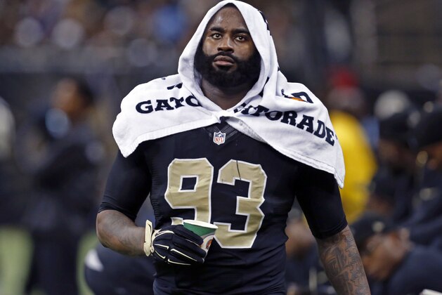 FILE - In this Nov. 24, 2014, file photo, New Orleans Saints outside linebacker Junior Galette (93) walks along the sideline during the second half of an NFL football game against the Baltimore Ravens in New Orleans. Galette says he expects to meet with NFL officials within a month to discuss his offseason arrest stemming from a domestic disturbance at his New Orleans-area home.  Prosecutors have dropped the case against Galette and his female accuser's attorney has withdrawn from a related civil lawsuit, leaving the Saints' 2014 sack leader optimistic his meeting with the league will go well.  (AP Photo/Jonathan Bachman, File)