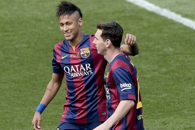 Barcelona's Argentinian forward Lionel Messi (R) celebrates a goal with Barcelona's Brazilian forward Neymar da Silva Santos Junior during the Spanish league football match FC Barcelona vs RC Deportivo La Coruna at the Camp Nou stadium in Barcelona on May 23, 2015.    AFP PHOTO / JOSEP LAGO        (Photo credit should read JOSEP LAGO/AFP/Getty Images)
