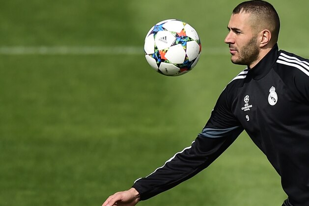 Real Madrid's French forward Karim Benzema trains at Valdebebas Sport City in Madrid on April 13, 2015 on the eve of their UEFA Champions League quarter final first leg football match against Atletico de Madrid. AFP PHOTO/ PIERRE-PHILIPPE MARCOU        (Photo credit should read PIERRE-PHILIPPE MARCOU/AFP/Getty Images)