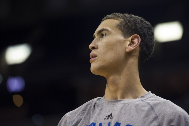 Dallas Mavericks forward Dwight Powell warms up before an NBA basketball game Monday, Jan. 19, 2015, in Memphis, Tenn. (AP Photo/Brandon Dill)