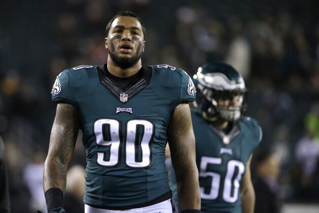 Philadelphia Eagles' Marcus Smith walks off the field during warm ups before an NFL football game against the Dallas Cowboys, Sunday, Dec. 14, 2014, in Philadelphia. (AP Photo/Michael Perez)