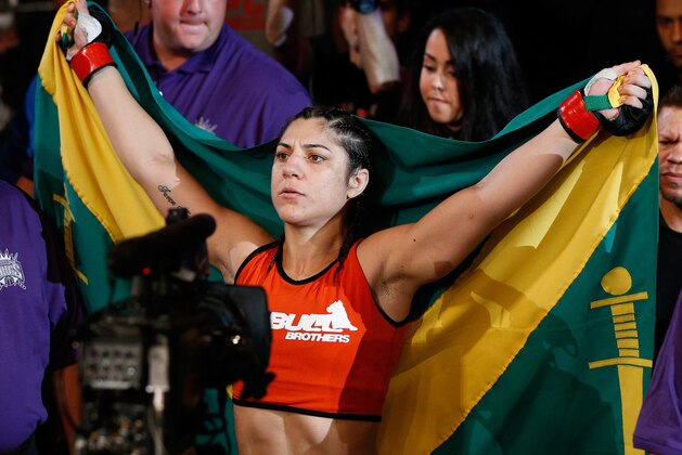 SACRAMENTO, CA - AUGUST 30:  Bethe Correia of Brazil enters the arena before her women's bantamweight bout against Shayna Baszler during the UFC 177 event at Sleep Train Arena on August 30, 2014 in Sacramento, California.  (Photo by Josh Hedges/Zuffa LLC/Zuffa LLC via Getty Images)