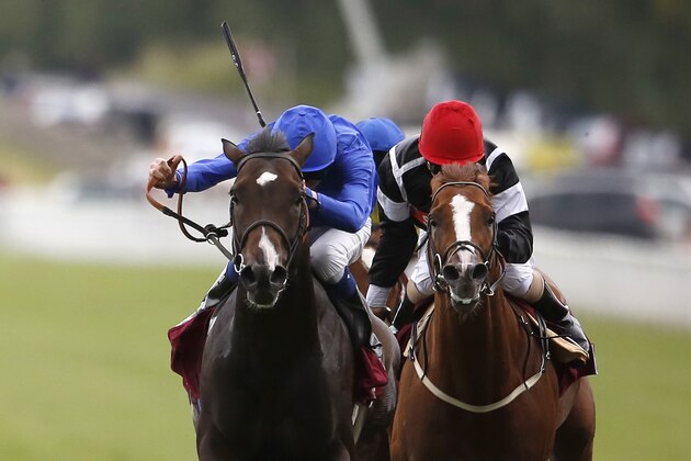 CHICHESTER, ENGLAND - JULY 28:  James Doyle riding Toormore (L. blue) win The Qatar Lennox Stakes at Goodwood racecourse on July 28, 2015 in Chichester, England. (Photo by Alan Crowhurst/Getty Images)