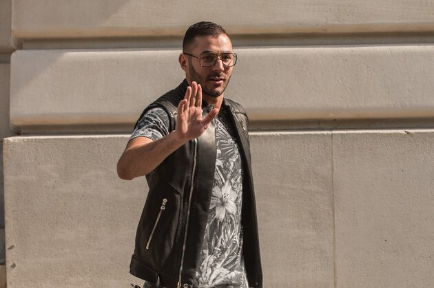 French soccer player Karim Benzema arrives at Balmain men's Spring/Summer 2016 collection, during Mode a Paris, in France, Saturday, June 27, 2015. (AP Photo/Kamil Zihnioglu)
