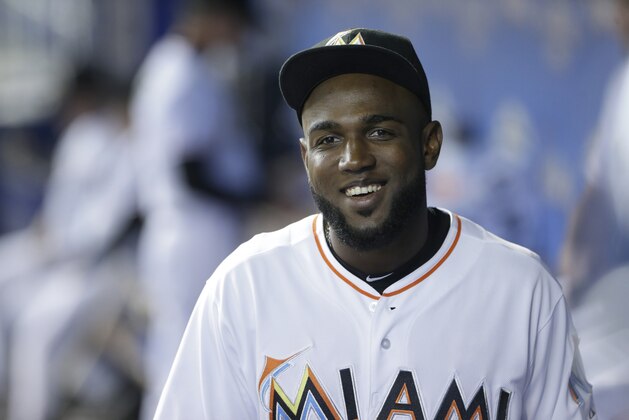 Miami Marlins' Marcell Ozuna is shown as he walks in the dugout before the start of a baseball game against the Chicago Cubs, Monday, June 1, 2015, in Miami. (AP Photo/Wilfredo Lee)