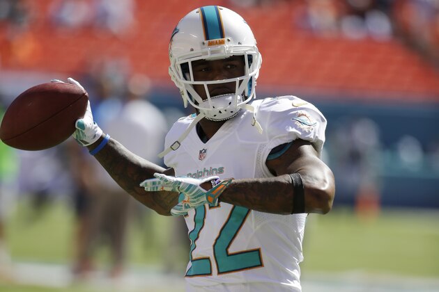 Miami Dolphins cornerback Jamar Taylor (22) warms up before an NFL football game against the San Diego Chargers, Sunday, Nov. 2, 2014, in Miami Gardens, Fla.  (AP Photo/Lynne Sladky)