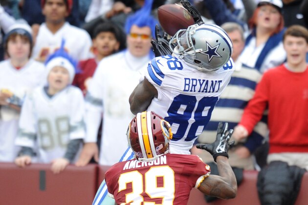 LANDOVER, MD - DECEMBER 28:  Wide receiver Dez Bryant #88 of the Dallas Cowboys catches a touchdown pass with pressure form cornerback David Amerson #39 of the Washington Redskins in the first quater during a NFL football game at FedExField on December 28, 2014 in Landover. Maryland.   (Photo by Mitchell Layton/Getty Images)