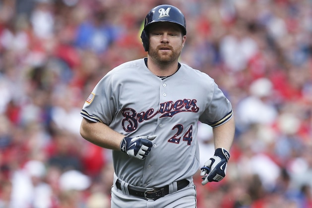 Milwaukee Brewers' Adam Lind runs home after hitting a solo home run off Cincinnati Reds starting pitcher Josh Smith in the fourth inning of a baseball game, Saturday, July 4, 2015, in Cincinnati. The Brewers won 7-3. (AP Photo/John Minchillo)
