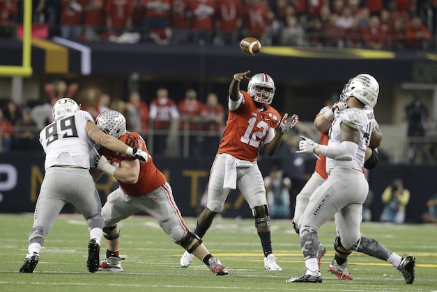 Ohio State quarterback Cardale Jones (12) throws during the second half of the NCAA college football playoff championship game against Oregon Monday, Jan. 12, 2015, in Arlington, Texas. (AP Photo/LM Otero)