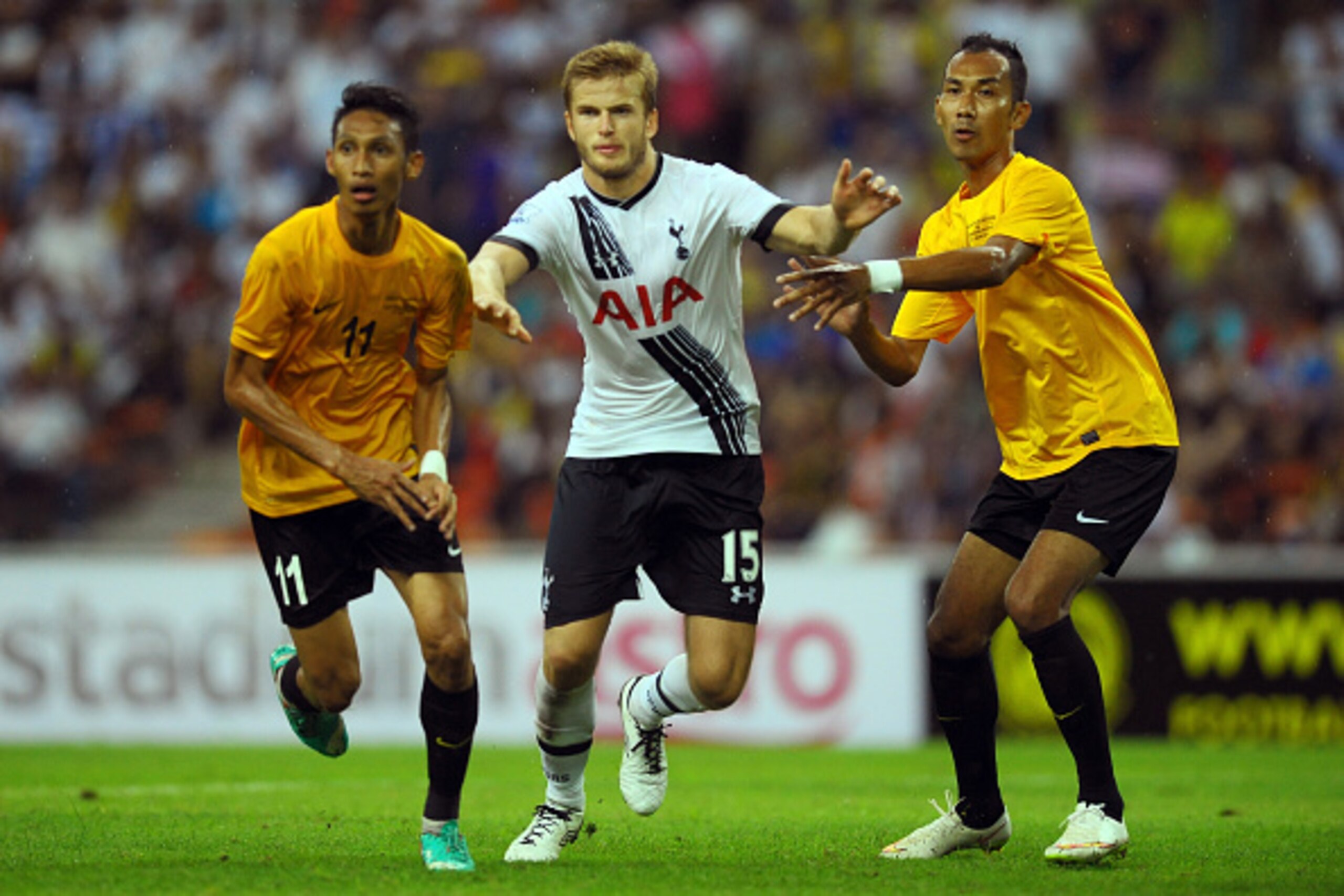 SHAH ALAM, MALAYSIA - MAY 27: Eric Dier of Tottenham Hotspur clashes with Ahmad Syamin and Norshahrul Idlan of Malaysia XI during the pre-season friendly match between Malaysia XI and Tottenham Hotspur at Shah Alam Stadium on May 27, 2015 in Shah Alam, Malaysia.  (Photo by Stanley Chou/Getty Images)