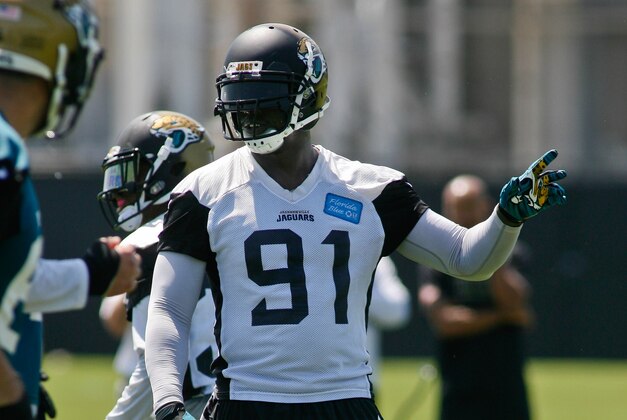 Jun 16, 2015; Jacksonville, FL, USA; Jacksonville Jaguars defensive end Chris Clemons (91) points during minicamp at the Florida Blue Health and Wellness Practice Fields. Mandatory Credit: Phil Sears-USA TODAY Sports