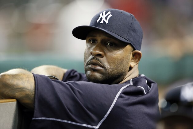 New York Yankees' CC Sabathia stands in the dugout in the eighth inning of a baseball game against the Texas Rangers Monday July 27, 2015, in Arlington, Texas. (AP Photo/Tony Gutierrez)