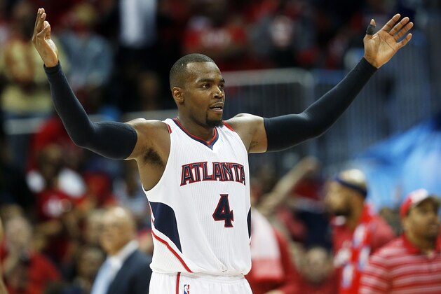 Atlanta Hawks' Paul Millsap reacts after a Hawks basket in the fourth quarter of Game 5 of the second round of the NBA basketball playoffs against the Washington Wizards Wednesday, May 13, 2015, in Atlanta. (AP Photo/John Bazemore)