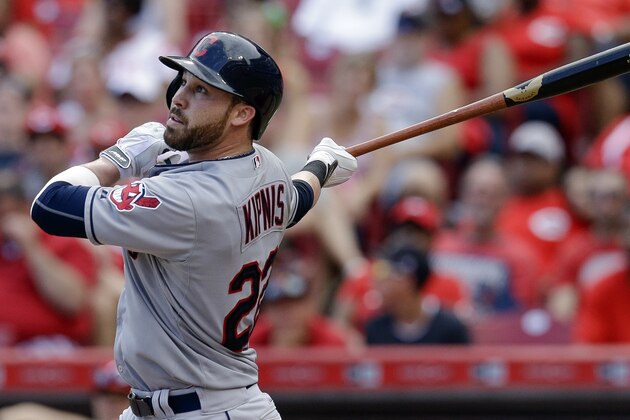 Cleveland Indians' Jason Kipnis hits a sacrifice fly off Cincinnati Reds relief pitcher Pedro Villarreal to drive in Michael Bourn in the eleventh inning of a baseball game, Sunday, July 19, 2015, in Cincinnati. The Indians won 5-3. (AP Photo/John Minchillo)