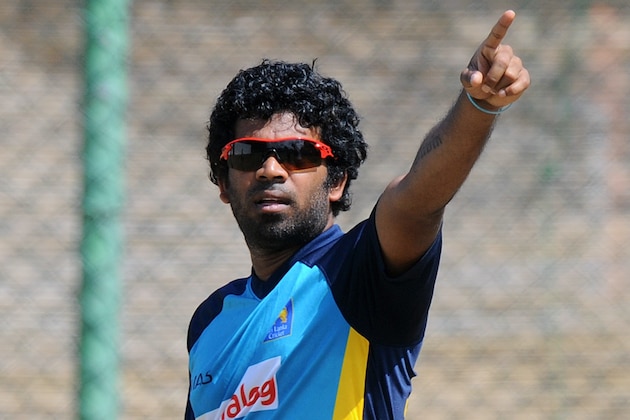 Sri Lanka's T20 cricket captain Lasith Malinga gestures during a practice session at the R. Premadasa International Cricket Stadium in Colombo on July 29, 2015. Sri Lanka and Pakistan first Twenty20 International match will be played from July 30 at the R Premadasa International Cricket Stadium.   AFP PHOTO / ISHARA S KODIKARA        (Photo credit should read Ishara S.KODIKARA/AFP/Getty Images)