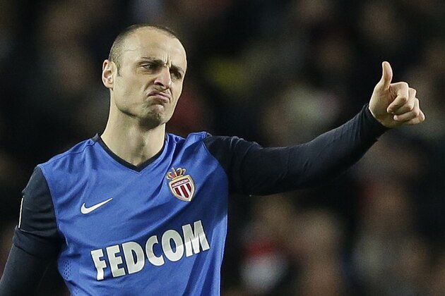 Monaco's Dimitar Berbatov gestures after scoring his side's second goal during the Champions League round of 16 soccer match between Arsenal and AS Monaco at the Emirates Stadium in London, Wednesday, Feb. 25, 2015.  (AP Photo/Matt Dunham)