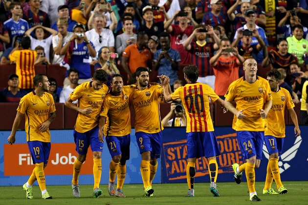 LANDOVER, MD - JULY 28: Luis Suarez #9 of Barcelona celebrates with teammates after scoring against Chelsea in the second half during the International Champions Cup North America at FedExField on July 28, 2015 in Landover, Maryland. Chelsea won in a penalty shootout. (Photo by Patrick Smith/Getty Images)