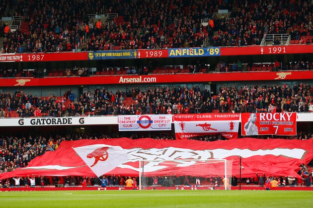 LONDON, ENGLAND - APRIL 26:  Arsenal fans show their support prior to the Barclays Premier League match between Arsenal and Chelsea at Emirates Stadium on April 26, 2015 in London, England.  (Photo by Julian Finney/Getty Images)