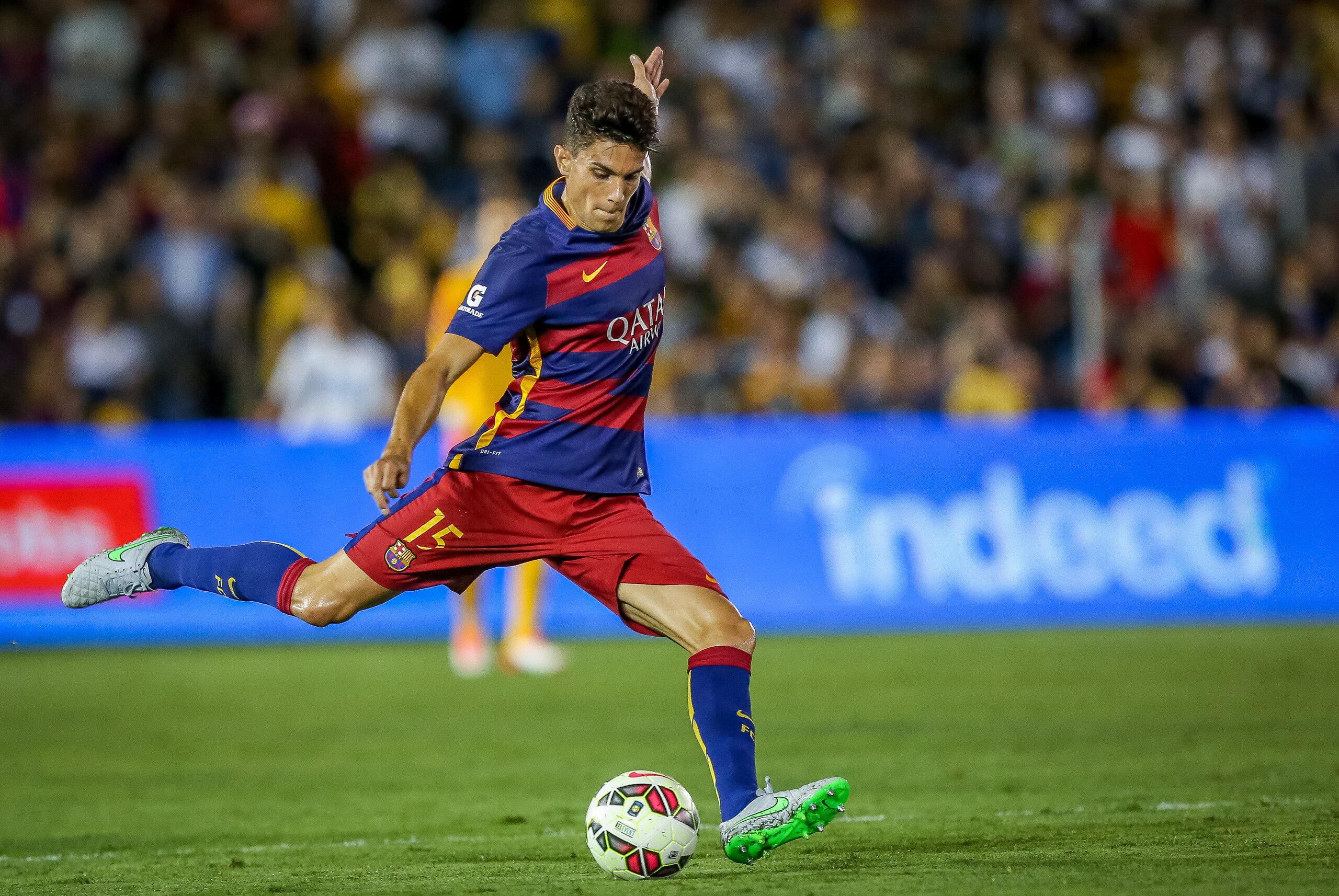 FC Barcelona's Marc Bartra kicks up field in the first half against Los Angeles Galaxy in Tuesday's soccer match in Pasadena, Calif., Tuesday, July 21, 2015. (Doug Benc/AP Images for International Champions Cup)