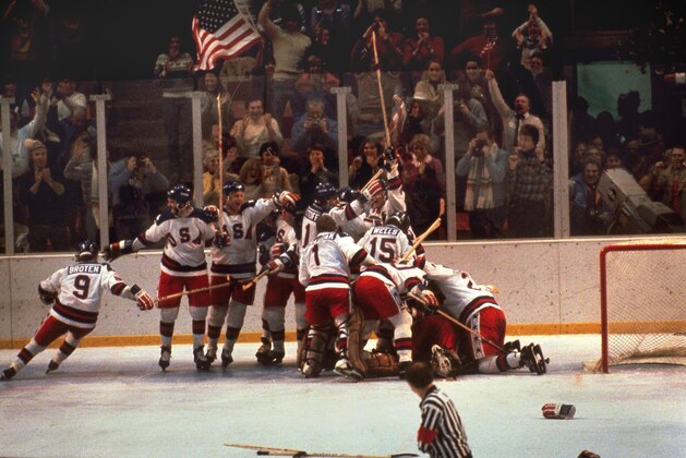 FILE -In this Feb. 22, 1980 file photo, the U.S. hockey team pounces on goalie Jim Craig after a 4-3 victory against the Soviets in the 1980 Olympics, as a flag waves from the partisan Lake Placid, N.Y. crowd. It’s been more than three decades since his landmark goal became the centerpiece of the U.S. Olympic hockey team’s Miracle on Ice. For 60-year-old Mike Eruzione, it still seems like only yesterday. (AP Photo, File)