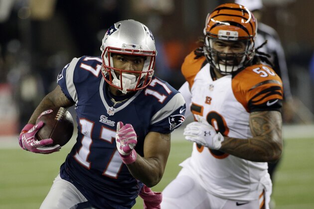 New England Patriots wide receiver Aaron Dobson (17) runs from Cincinnati Bengals middle linebacker Rey Maualuga (58) after catching a pass in the second half of an NFL football game Sunday, Oct. 5, 2014, in Foxborough, Mass. (AP Photo/Stephan Savoia)