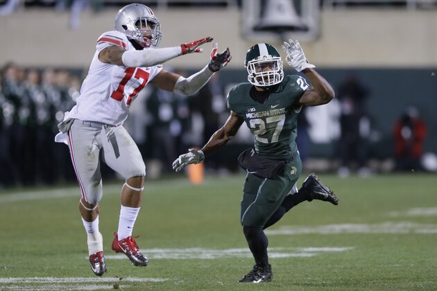 Michigan State safety Kurtis Drummond defends Ohio State running back Jalin Marshall (17) during the second half of an NCAA college football game against Ohio State in East Lansing, Mich., Saturday, Nov. 8, 2014. (AP Photo/Carlos Osorio) Michigan State safety Kurtis Drummond defends Ohio State running back Jalin Marshall (17) during the second half of an NCAA college football game against Ohio State in East Lansing, Mich., Saturday, Nov. 8, 2014. (AP Photo/Carlos Osorio)