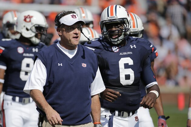 Auburn head coach Gus Malzahn talks with Auburn quarterback Jeremy Johnson (6) in the first half of an NCAA college football game in Auburn, Ala., Saturday, Oct. 12, 2013. (AP Photo/Dave Martin)