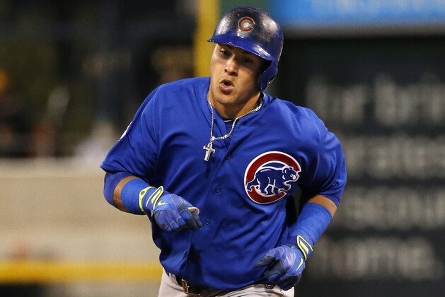Chicago Cubs' Javier Baez rounds third after hitting a two-run home run off Pittsburgh Pirates starting pitcher Jeff Locke during the third inning of a baseball game in Pittsburgh Saturday, Sept. 13, 2014. (AP Photo/Gene J. Puskar)