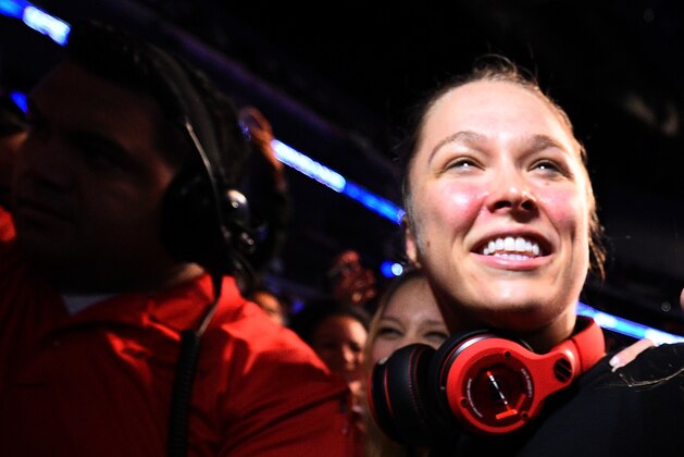 LOS ANGELES, CA - FEBRUARY 28:  Ronda Rousey celebrates with her family after her victory over Cat Zingano in their UFC women's bantamweight championship bout during the UFC 184 event at Staples Center on February 28, 2015 in Los Angeles, California.  (Photo by Jeff Bottari/Zuffa LLC/Zuffa LLC via Getty Images)