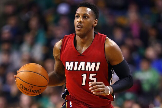 Miami Heat guard Mario Chalmers brings the ball up court against the Boston Celtics during the first half of an NBA basketball game in Boston Sunday, Feb. 1, 2015. (AP Photo/Winslow Townson)
