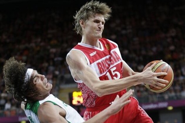 Russia's Andrei Kirilenko (15) crashes into Brazil's Anderson Varejao, left, as he drives to the basket during a preliminary men's basketball game at the 2012 Summer Olympics, Thursday, Aug. 2, 2012, in London. (AP Photo/Eric Gay)