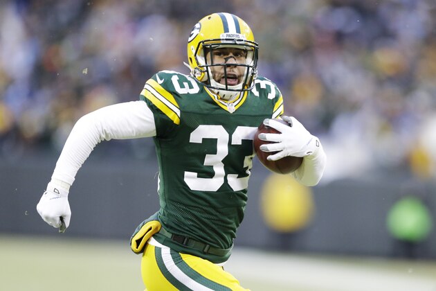 Green Bay Packers' Micah Hyde runs back a punt 55 yards for a touchdown during the first half of an NFL football game against the Detroit Lions Sunday, Dec. 28, 2014, in Green Bay, Wis. (AP Photo/Tom Lynn)