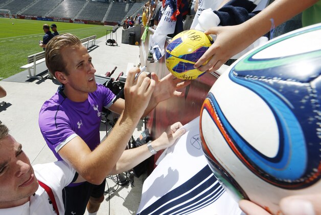 Tottenham Hotspur striker Harry Kane signs autographs after a practice for the Major League Soccer All-Star game, Tuesday, July 28, 2015, in Commerce City, Colo. The MLS all-star squad will face the Tottenham Hotspur Wednesday night in Dick's Sporting Goods Park in the 20th annual mid-season classic for the league. (AP Photo/David Zalubowski)