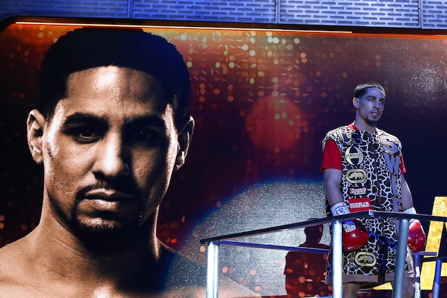 NEW YORK, NY - APRIL 11:  Danny Garcia makes his entrance before his fight against Lamont Peterson during the Premier Boxing Champions Middleweight bout at Barclays Center on April 11, 2015 in the Brooklyn borough of  New York City.  (Photo by Elsa/Getty Images)