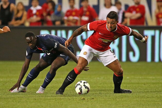 CHICAGO, IL - JULY 29: Memphis Depay #9 of Manchester United battle with Serge Aurier #19 of Paris Saint-Germain during a match in the 2015 International Champions Cup at Soldier Field on July 29, 2015 in Chicago, Illinois. (Photo by Jonathan Daniel/Getty Images)