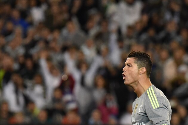 Real Madrid's Cristiano Ronaldo gestures to the crowd after scoring a goal during the International Champions Cup Australia football match between English Premier League team Manchester City and Spanish side Real Madrid in Melbourne on July 24, 2015. Real Madrid won the match 4-1. AFP PHOTO / Paul CROCK -- IMAGE RESTRICTED TO EDITORIAL USE - STRICTLY NO COMMERCIAL USE        (Photo credit should read PAUL CROCK/AFP/Getty Images)