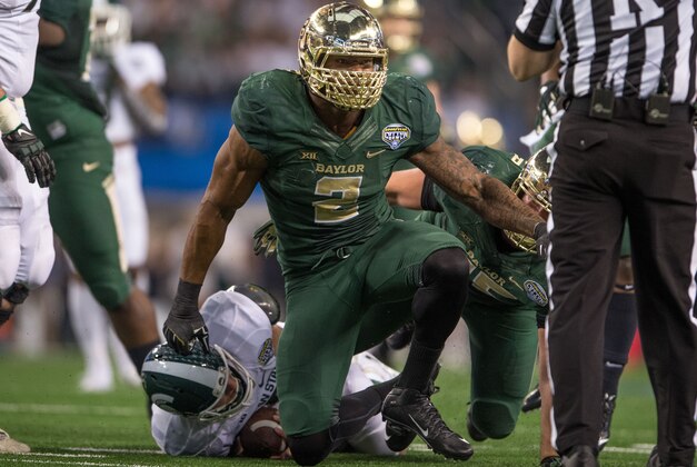 Jan 1, 2015; Arlington, TX, USA; Baylor Bears defensive end Shawn Oakman (2) celebrates his sack of Michigan State Spartans quarterback Connor Cook (18) during the first half in the 2015 Cotton Bowl Classic at AT&T Stadium. Mandatory Credit: Jerome Miron-USA TODAY Sports