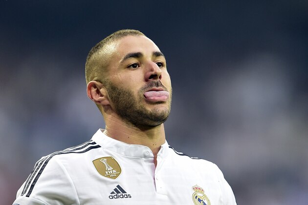 Real Madrid's French forward Karim Benzema sticks out his tongue during the UEFA Champions League semi-final second leg football match Real Madrid FC vs Juventus at the Santiago Bernabeu stadium in Madrid on May 13, 2015.   AFP PHOTO/ GERARD JULIEN        (Photo credit should read GERARD JULIEN/AFP/Getty Images)