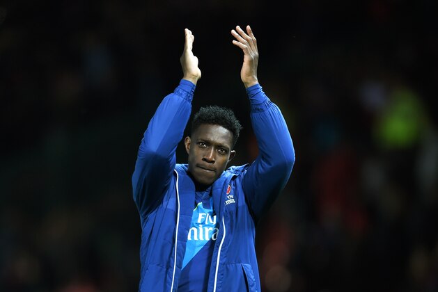 MANCHESTER, ENGLAND - MARCH 09:  Matchwinning goal scorer Danny Welbeck of Arsenal applauds the travelling fans following their team's 2-1 victory during the FA Cup Quarter Final match between Manchester United and Arsenal at Old Trafford on March 9, 2015 in Manchester, England.  (Photo by Michael Regan/Getty Images)