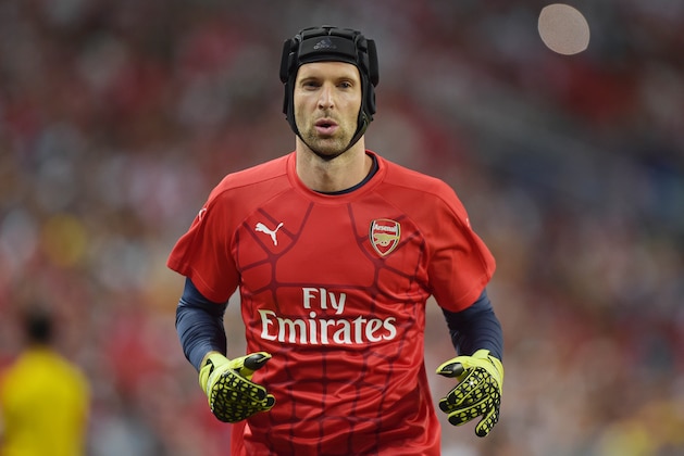 Arsenal goalkeeper Petr Cech warms up ahead of his team's soccer match against Everton for the Barclays Asia Trophy in Singapore, Saturday, July 18, 2015.(AP Photo/Joseph Nair)