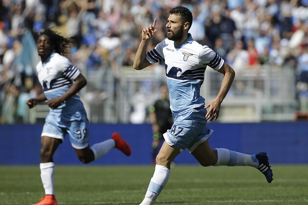 Lazio's Antonio Candreva, right, celebrates after scoring during a Serie A soccer match between Lazio and Empoli in Rome's Olympic stadium, Sunday, April 12, 2015. (AP Photo/Gregorio Borgia)