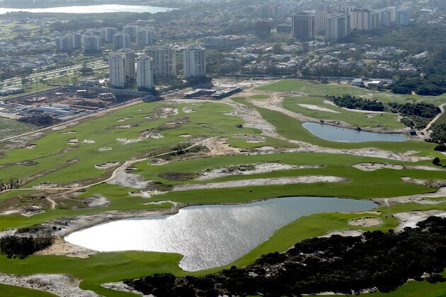 RIO DE JANEIRO, BRAZIL - JULY 21:  Construction continues at the golf course in the Barra da Tijuca neighborhood with nearly one year to go to the Rio 2016 Olympic Games on July 21, 2015 in Rio de Janeiro, Brazil.  (Photo by Matthew Stockman/Getty Images)