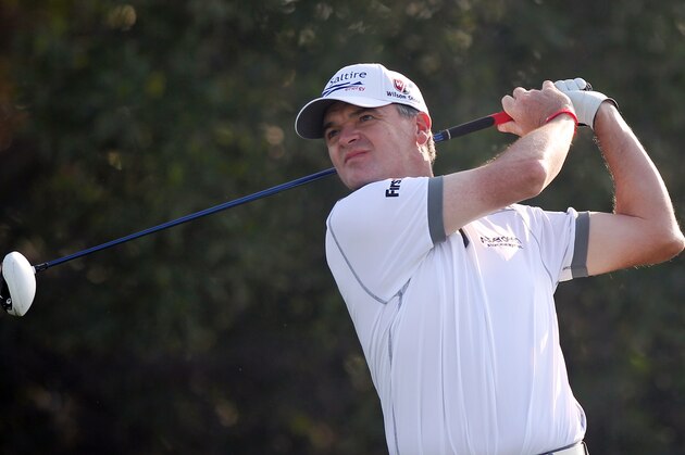 Paul Lawrie of Scotland hits his tee shot on the 10th hole during the second round of the Commercial Bank Qatar Masters at the Doha Golf Club in Doha, Qatar, Thursday, Jan. 23, 2014. (AP Photo/Osama Faisal)