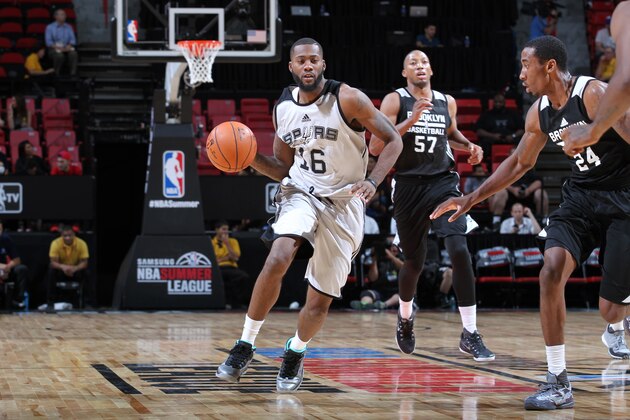 LAS VEGAS, NV - JULY 16: Jonathan Simmons #16 of the San Antonio Spurs drives against the Brooklyn Nets during the 2015 NBA Las Vegas Summer League game on July 16, 2015 at Thomas & Mack Center in Las Vegas, Nevada. NOTE TO USER: User expressly acknowledges and agrees that, by downloading and or using this photograph, User is consenting to the terms and conditions of the Getty Images License Agreement. Mandatory Copyright Notice: Copyright 2015 NBAE  (Photo by Jack Arent/NBAE via Getty Images)