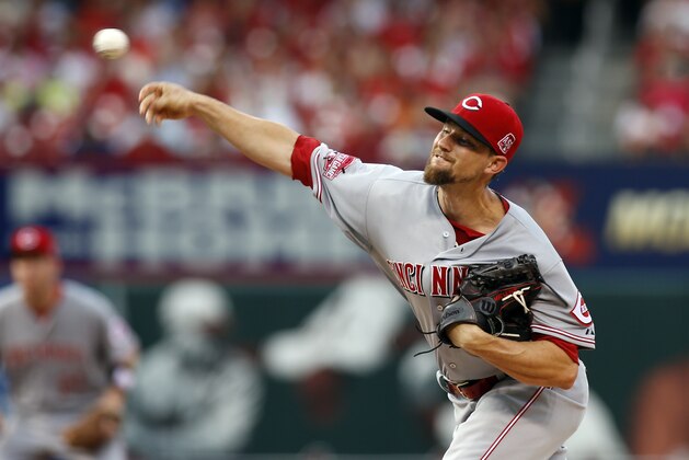 Cincinnati Reds starting pitcher Mike Leake  throws during the first inning of a baseball game against the St. Louis Cardinals Tuesday, July 28, 2015, in St. Louis. (AP Photo/Scott Kane)