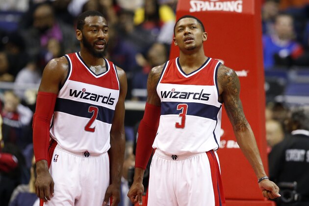 Washington Wizards guard John Wall (2) and guard Bradley Beal (3) stand on the court in the second half of an NBA basketball game, Wednesday, Jan. 7, 2015, in Washington. The Wizards won 101-91.(AP Photo/Alex Brandon)