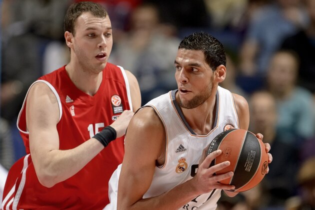 Real Madrid's Tunisian center Salah Mejri (R) vies with Strasbourg's center Romain Duport during the Euroleague basketball match Real Madrid vs IG Strasbourg  at the Palacio de Deportes de la Communidad de Madrid on December 13, 2013.  AFP PHOTO / DANI POZO        (Photo credit should read DANI POZO/AFP/Getty Images)