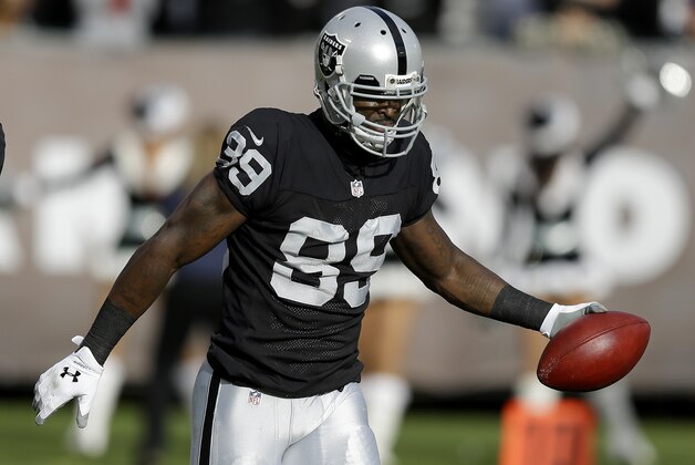 Oakland Raiders wide receiver James Jones (89) celebrates after scoring on a 3-yard touchdown reception against the Buffalo Bills during the second quarter of an NFL football game in Oakland, Calif., Sunday, Dec. 21, 2014. (AP Photo/Ben Margot)